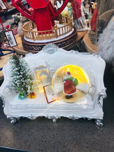 Resin made wind up musical chair with snow globe and santa