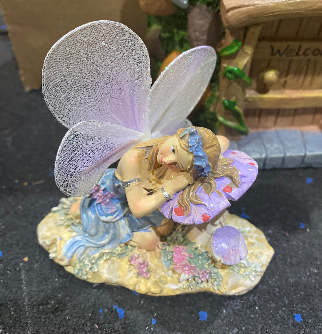 8CM LONG RESTING GLITTER FAIRY ON MUSHROOM